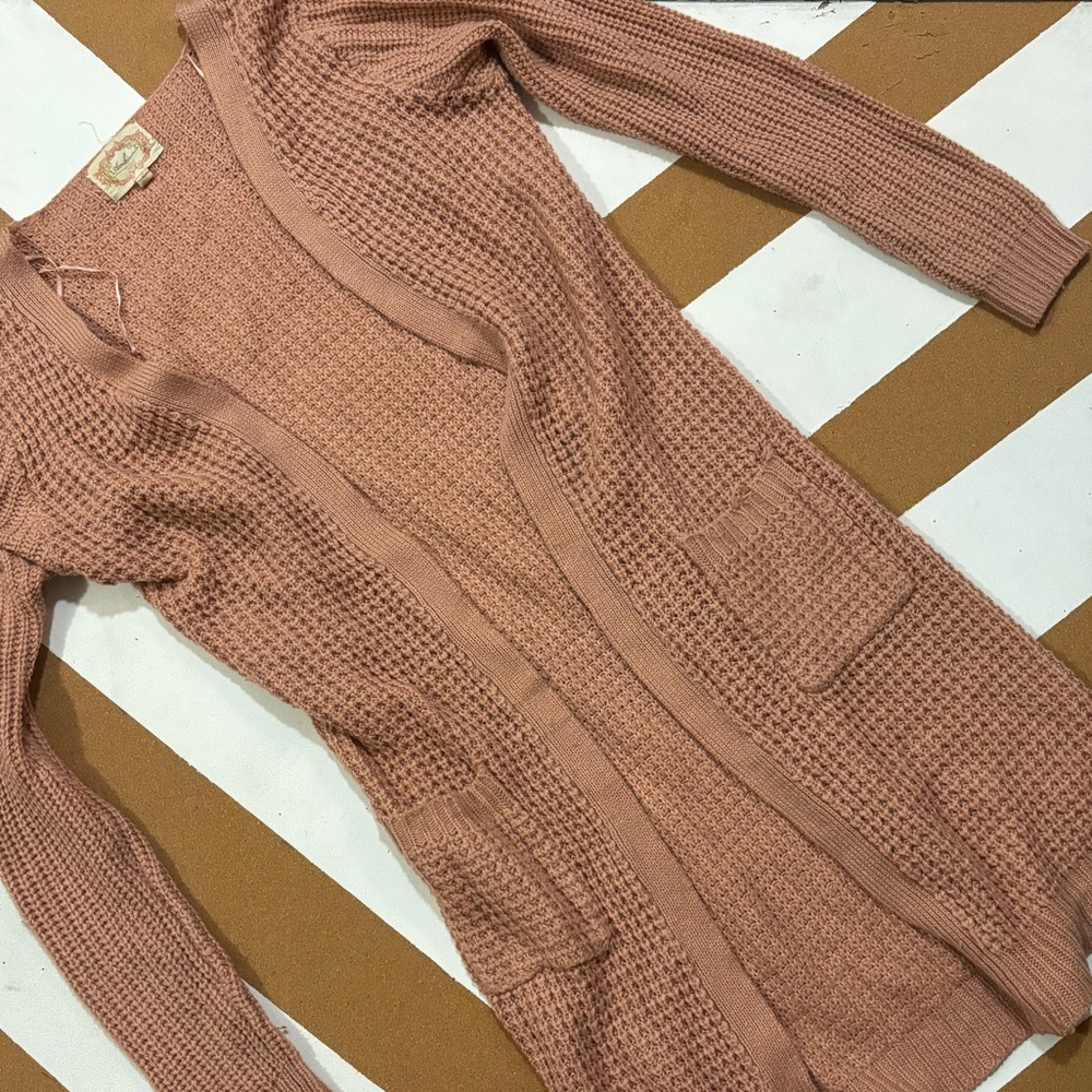 Faded pink sweater shall
